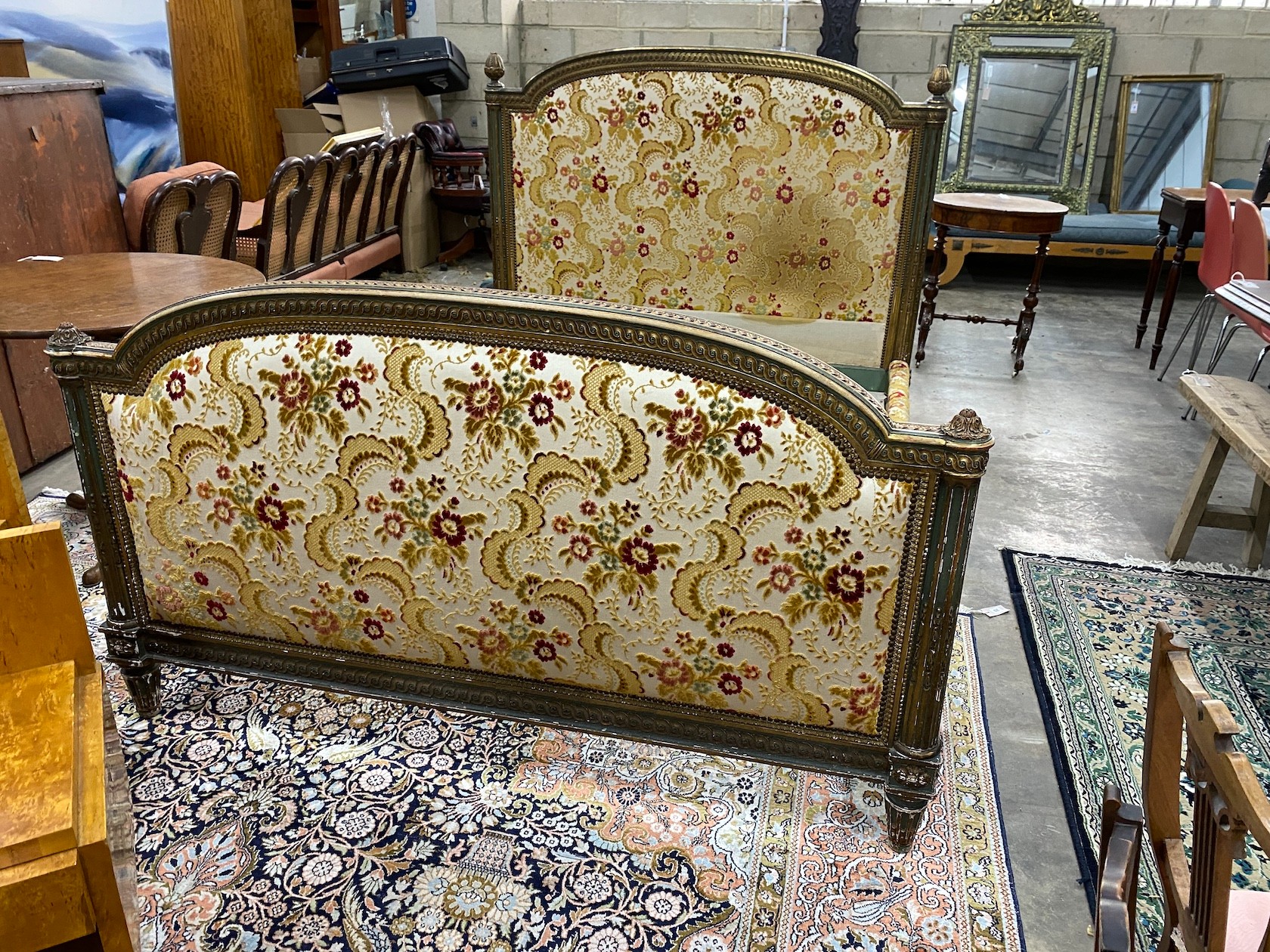 A Louis XVI style carved parcel gilt double bedframe, width 160cm, length 224cm, height 127cm